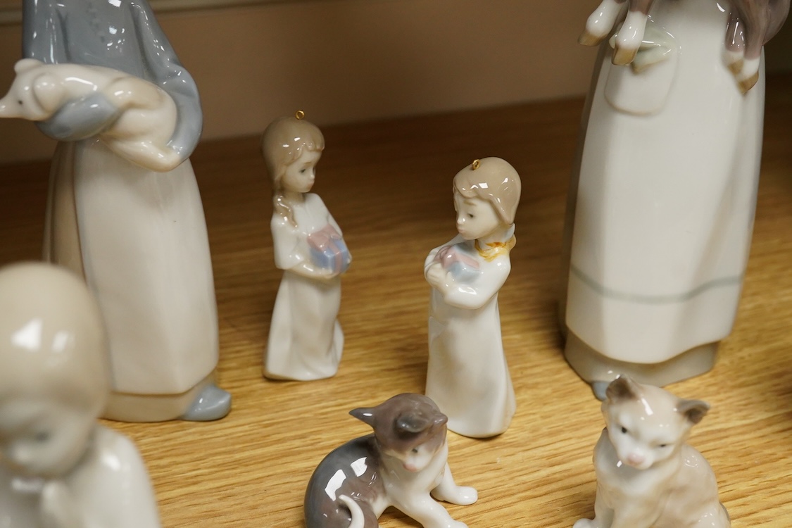 A group of twelve Lladro figures/animals, tallest 23cm